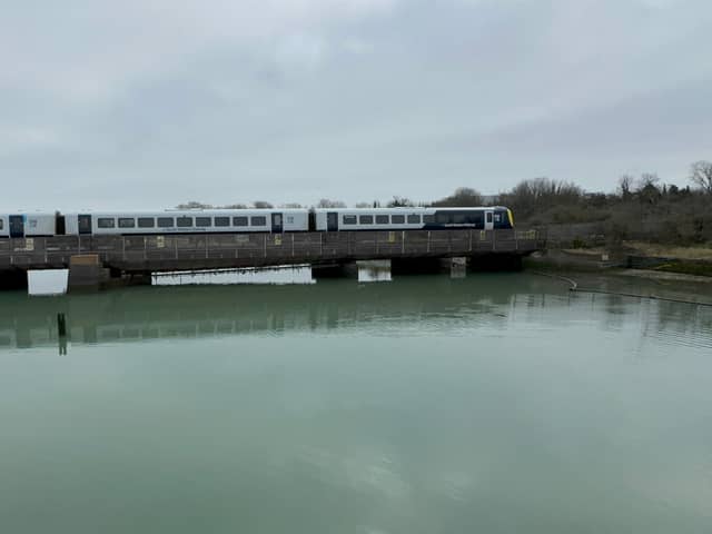 A train passing over the Portcreek Viaduct in Portsmouth