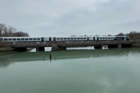 A train passing over the Portcreek Viaduct in Portsmouth