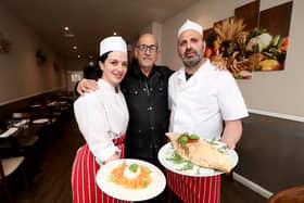 Bella Calabria in North End, Portsmouth has changed its name to Amuri and has launched a new menu. 

Pictured: Manager Giovanni Vaccaro (centre) with staff Marika Di Bari and head chef and owner Seby Fortuna with their new dishes, Calzone All Bolognese and Mozzarella Caprese

Picture: Habibur Rahman