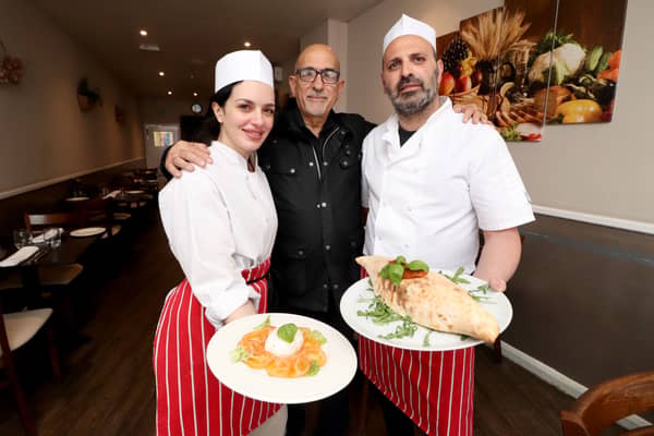 Bella Calabria in North End, Portsmouth. 

Pictured: Manager Giovanni Vaccaro (centre) with staff Marika Di Bari and head chef and owner Seby Fortuna. 

Picture: Habibur Rahman