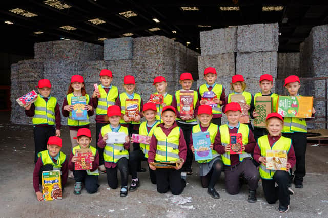 Children from Prudhoe Castle Primary School posed with a giant 500kg recycled paper bale equivalent to over 4,237 rolls of toilet paper.