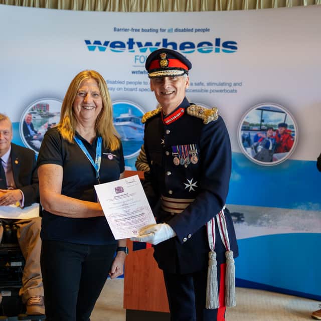 Lord-Lieutenant of Hampshire, Nigel Atkinson, presents the King’s award for voluntary service certificate to Wetwheels Hamble Operations Director, Suez Tyrwhitt-Williams