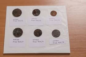 Six coins dating back to the 19th centuries which have been discovered beneath the foremast of HMS Victory after the masts were removed in the latest stage of a 10-year £42m restoration project.
