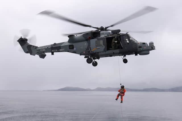 A Wildcat HMA2 from 815 Naval Air Squadron conducts winching with HMS Example during Exercise Tamber Shield.