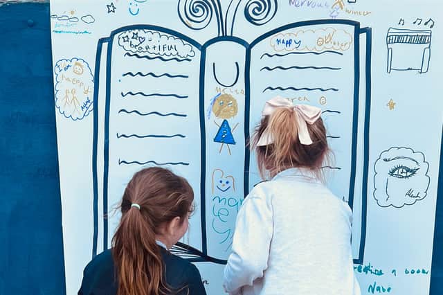 Children work on the playground mural at St George’s Beneficial Primary School in Portsea