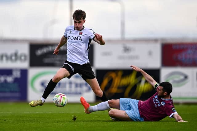 Pompey-bound Eoin Kenny of Dundalk is tackled by Ryan Brennan of Drogheda United during League of Ireland action.