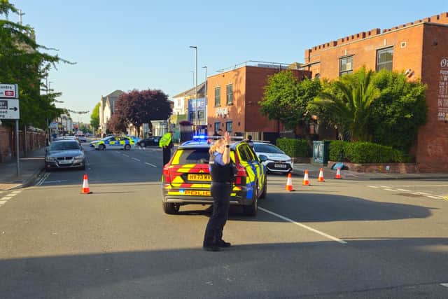 Police close the road after a collision in Victoria Road South