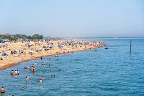 People enjoying the bank holiday sun at Southsea Beach. Pictured by Alec Chapman