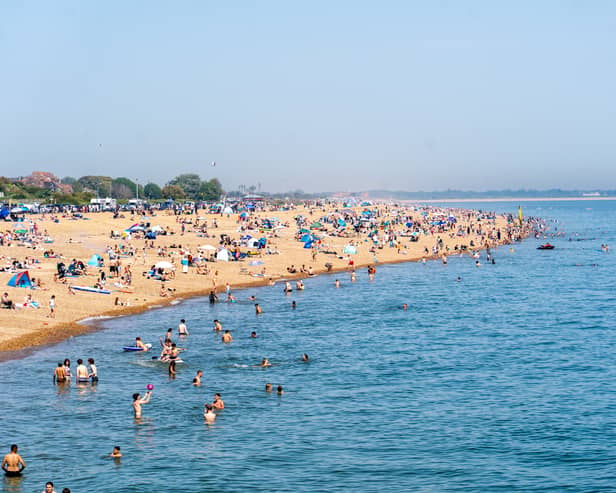 People enjoying the bank holiday sun at Southsea Beach. Pictured by Alec Chapman
