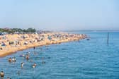 People enjoying the bank holiday sun at Southsea Beach. Pictured by Alec Chapman
