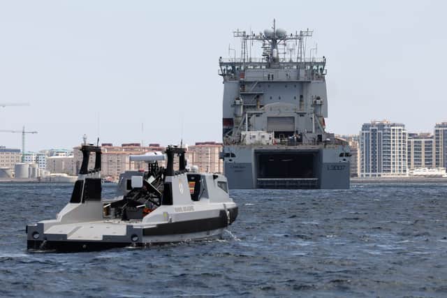 RFA Lyme Bay flooding its dock to embark RNMB Ariadne.