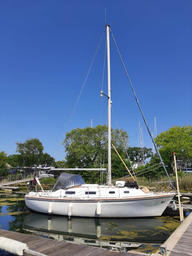 Five men have been arrested after a yacht carrying seven people to the UK illegally was intercepted in Chichester