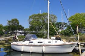 Five men have been arrested after a yacht carrying seven people to the UK illegally was intercepted in Chichester