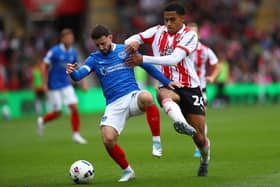 Shea Charles battling Pompey's Conor Chaplin.