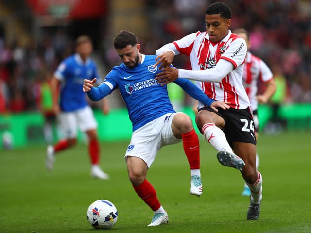 Shea Charles battling Pompey's Conor Chaplin.