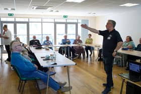 The Royal British Legion runs a support group in Gosport which supports veterans with dementia. Pictured is organiser Cliff Cropley, Royal Navy veteran, speaking to the attendees.