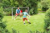 The foldable football goal includes a sturdy metal frame and provides plenty of space for family kickabouts and football practice in the garden.