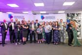 Winners gather on stage at the University of Portsmouth Student Impact Awards