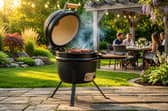 The compact ceramic BBQ is designed to deliver smoky charcoal cooking in gardens, patios and campsites