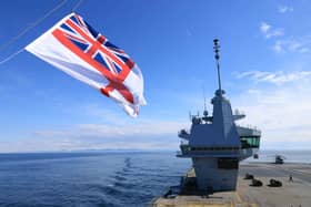 Pictured: The Royal Navy Ensign flying the on forward tower of HMS Prince of Wales. The UKCSG involvement in Exercise Dynamic Mongoose has been described as a "real success."
