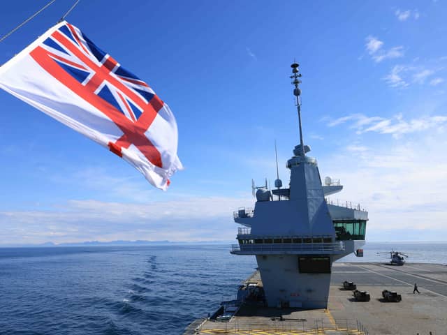 Pictured: The Royal Navy Ensign flying the on forward tower of HMS Prince of Wales. The UKCSG involvement in Exercise Dynamic Mongoose has been described as a "real success."