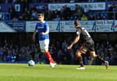 Shaun Cooper playing for Pompey, as the club moved into community ownership against Sheffield United in 2013.