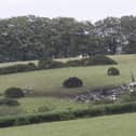 The scene in Sourton Down, near Okehampton in Devon, where a Royal Navy helicopter crashed in a field just before 4am today. Picture date: Wednesday June 3, 2026.