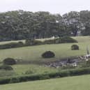 The scene in Sourton Down, near Okehampton in Devon, where a Royal Navy helicopter crashed in a field just before 4am today. Picture date: Wednesday June 3, 2026.