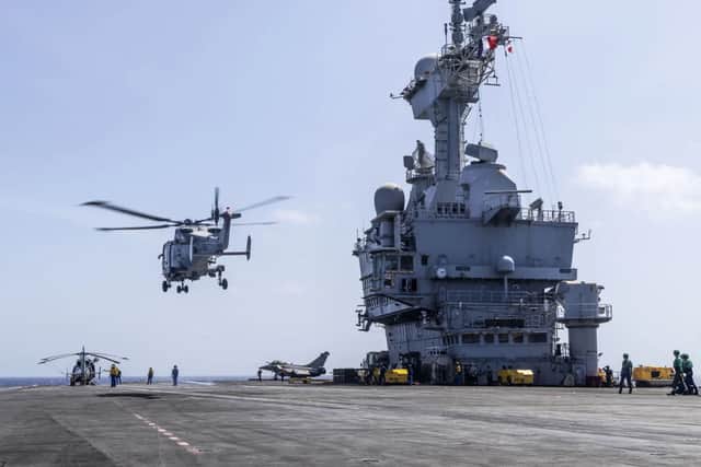 HMS Dragons Wildcat helicopter lifts off from Frances flagship FS Charles de Gaulle