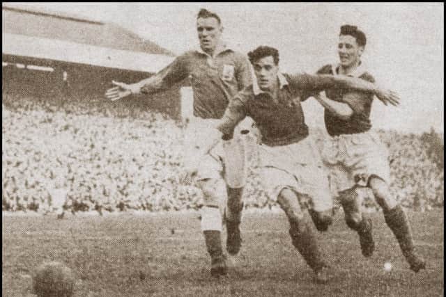 Peter Higham in action on his Pompey debut against Birmingham City in February 1950. Picture: The News/PHS Archive
