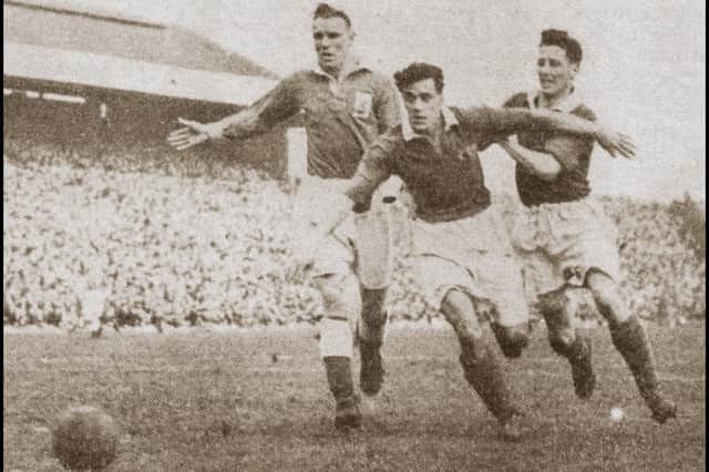 Peter Higham in action on his Pompey debut against Birmingham City in February 1950. Picture: The News/PHS Archive
