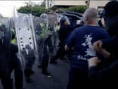 Police and protesters clashing in Southampton during a protest following the death of Henry Nowak