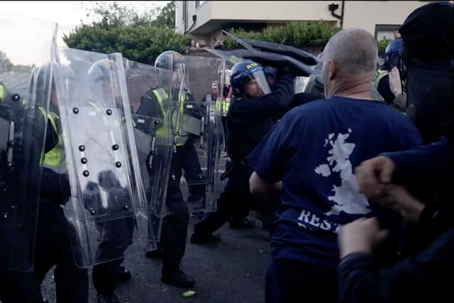 Police and protesters clashing in Southampton during a protest following the death of Henry Nowak