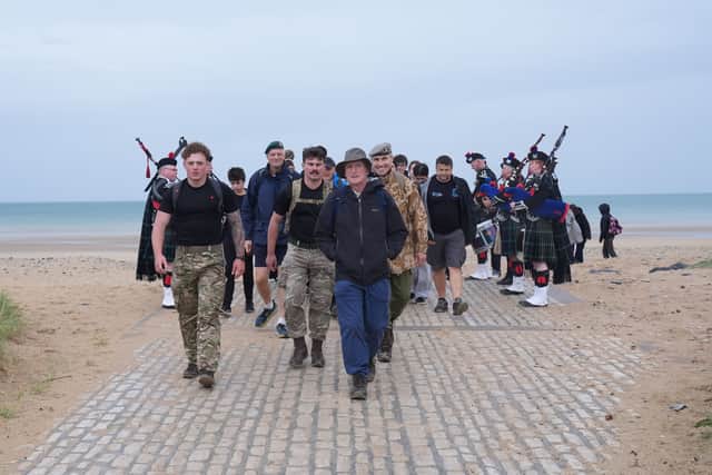 Field Marshal Montgomery's grandson, Henry Montgomery (centre) on Juno Beach in Courseulles-sur-Mer, completing a 22km walk along the French coastline taking in Sword, Juno and Gold Beaches, in honour of the servicemen who landed there more than 80 years ago. It is the final stage of a 4,000-mile journey 'In Monty's Footsteps', which began two months ago and is fundraising in support of the British Normandy Memorial's education programme, Operation Remembrance. Picture date: Saturday June 6, 2026. PA Photo. Photo credit should read: Gareth Fuller/PA Wire