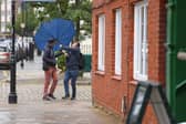 Brolly trouble in the High Street. Wild weather on Saturday morning in Old Portsmouth
Picture: Chris Moorhouse (060626-16)
