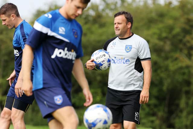 Pompey strength and conditioning coach Louis Langdown during pre-season in July 2014 - now his son has joining the Fratton Park staff. Picture: Joe Pepler