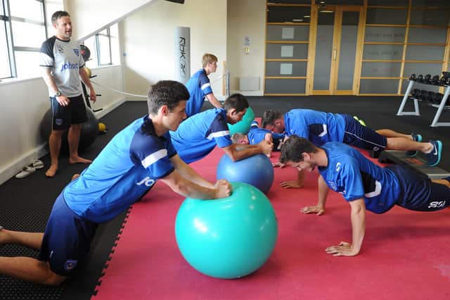 Louis Langdown putting Pompey's squad through their paces in pre-season in July 2013. Picture: Sarah Standing