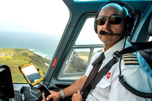 Participants can enjoy panoramic aerial views while flying with experienced pilots during the Adventure 001 helicopter experience.