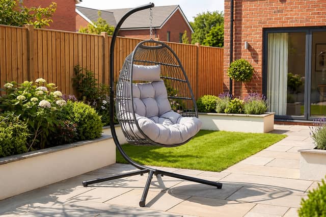 The stylish dark grey hanging egg chair could become the standout feature in any patio or garden setting