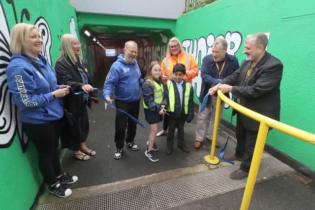 Pictured:   Seekers Create Clair Martin and Steve Baker with Stamshaw Junior School pupils, PCC , Colas and cllr Richard Adair and Cllr Lee Hunt unveiling the plaque to mark the opening of the doodle underpass
Picture: Habibur Rahman