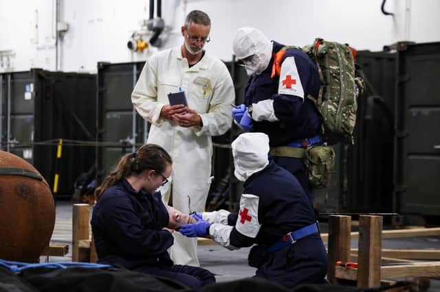 The medical team responding to a casualty during an exercise. Ship's company of RFA Lyme Bay have been training with FOST at sea, they have been doing exercises on firefighting, damage control and causality evacuation, preparing them for future operations in the Gulf.