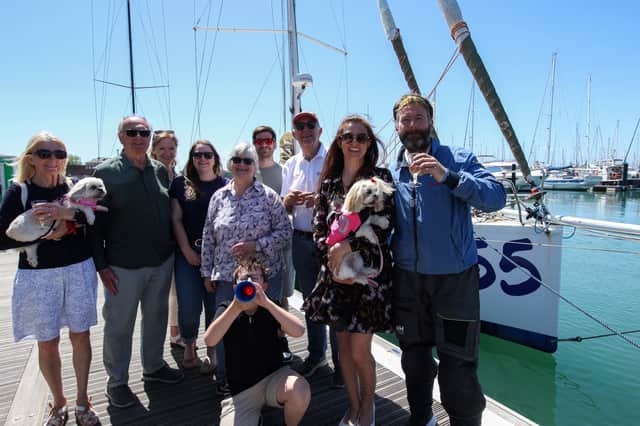 James Ketchell is the first person ever to circumnavigate the globe by air, land and sea. He is pictured here, right, with his family after arriving home at Gosport