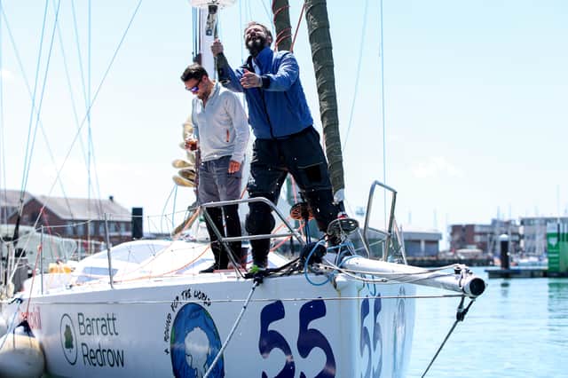 James Ketchell is the first person ever to circumnavigate the globe by air, land and sea. He is pictured here, right, with his family after arriving home at Gosport