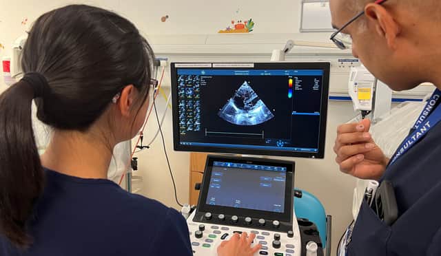 Dr Hushi Hu and Dr Ramkrishna Ramnauth reviewing a patient scan