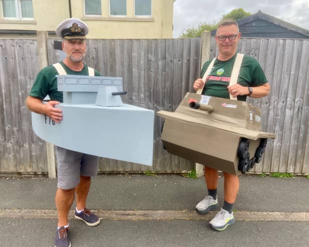 Wearing mock-up models of armoured vehicle, former Royal Navy captain John Kelly and civil servant Graeme Lloyd are preparing to set off on a long-distance walk in costumes to raise money for good causes.