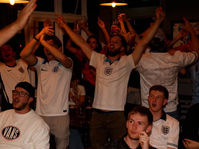 Fans celebrate at the Red Lion pub in Cosham