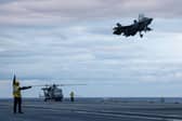 Pictured: F-35B Lightning Jets landing on the flight deck on Fleet Flagship, HMS Prince of Wales.