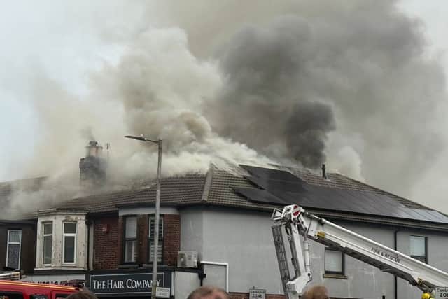 Smoke can be seen pouring from a flat in Cosham as the public are warned to avoid the area.