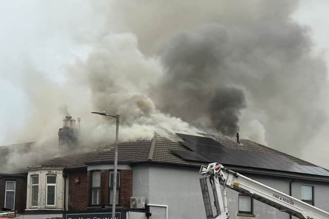 Smoke can be seen pouring from a flat in Cosham as the public are warned to avoid the area.