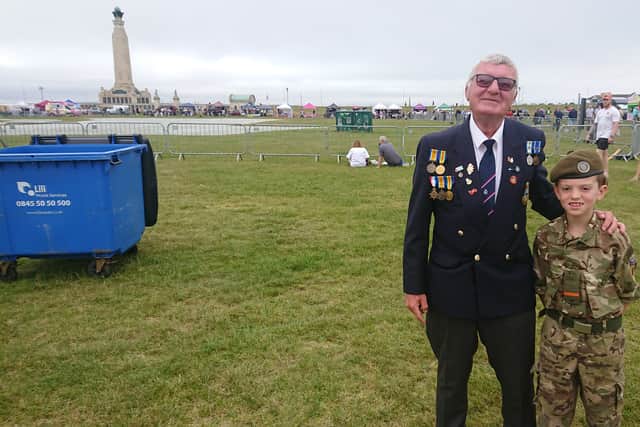 Tony May, 68, former Royal Navy Petty Officer who served for 24 years, alongside ten-year-old Army cadet Bret Logan.